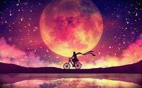 Man on a bike with the moon